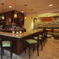 Michelle B. Field , MBF Interior Design Hospitality Designer, Hilton Garden Inn - Oaks, PA Lobby Bar pendant lighting, stone wall, bar stools